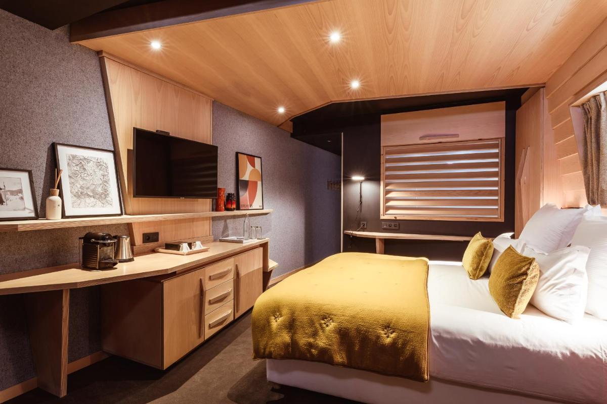 Un ou plusieurs lits dans un hébergement de l'établissement Altapura Hôtel & Spa Val Thorens