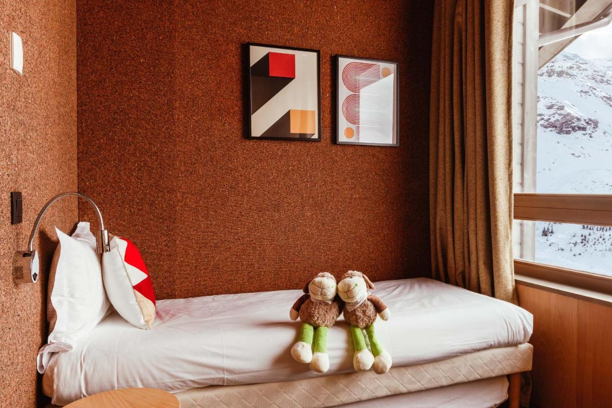 Un ou plusieurs lits dans un hébergement de l'établissement Altapura Hôtel & Spa Val Thorens