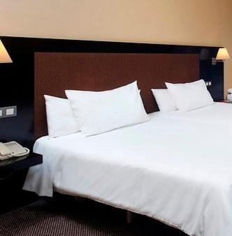 Cama o camas de una habitación en HG Alto Aragón