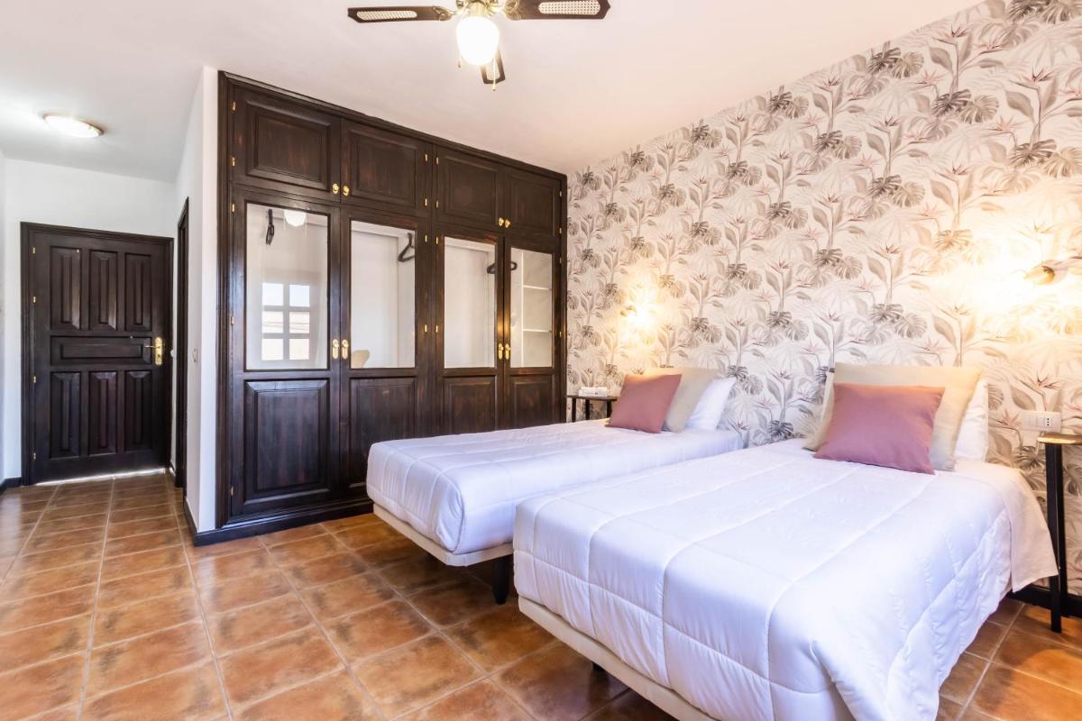 Cama o camas de una habitación en Hotel Ecolife Tenerife