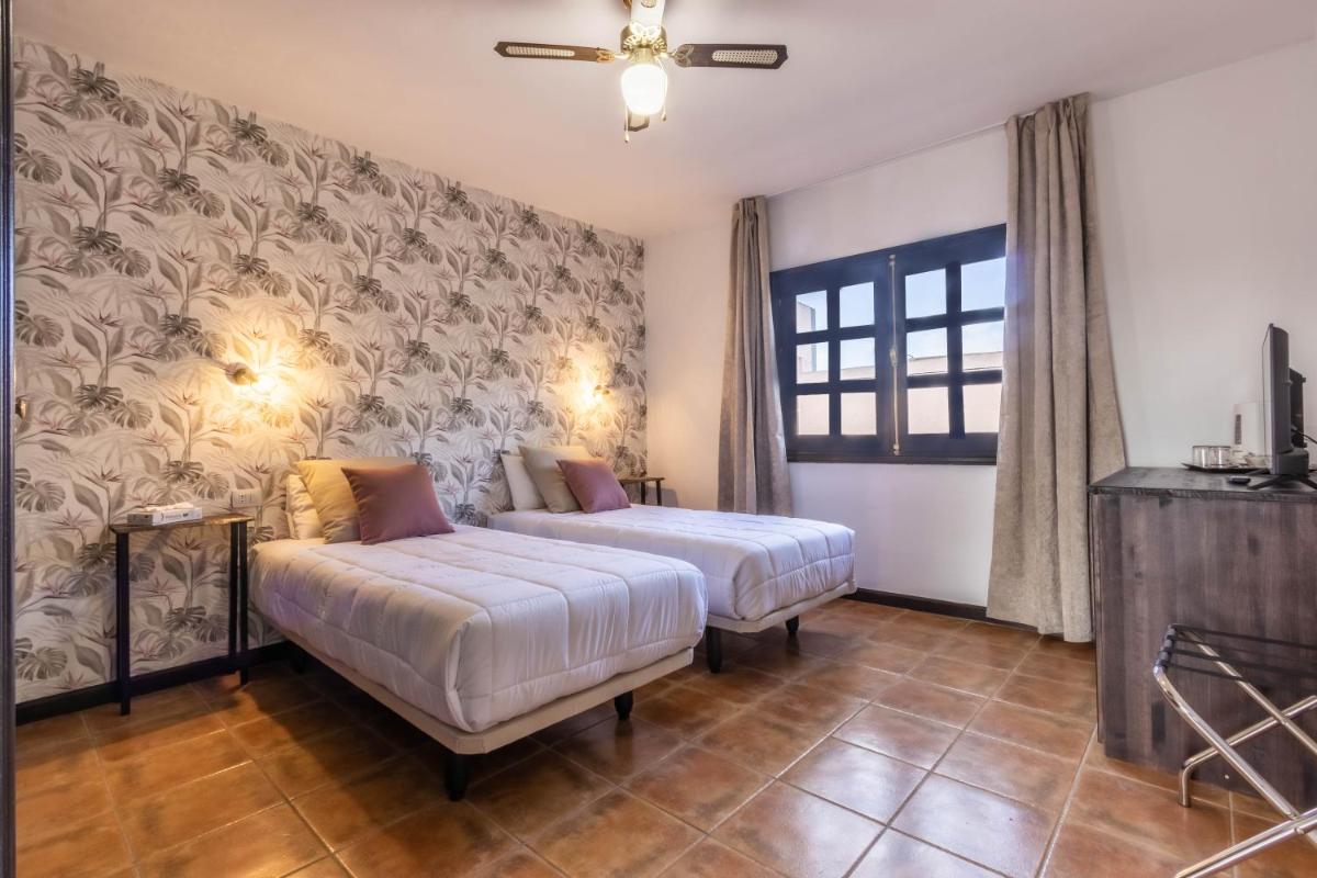Cama o camas de una habitación en Hotel Ecolife Tenerife