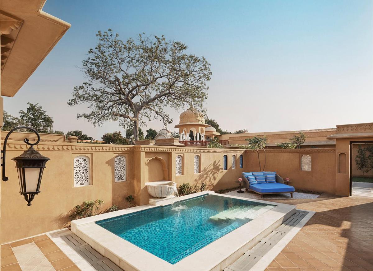 a swimming pool in the backyard of a house at Sawai Man Mahal in Jaipur