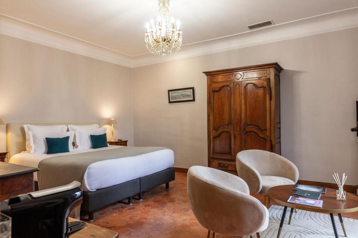Un ou plusieurs lits dans un hébergement de l'établissement Hôtel - Restaurant & Spa La Magdeleine - Mathias Dandine