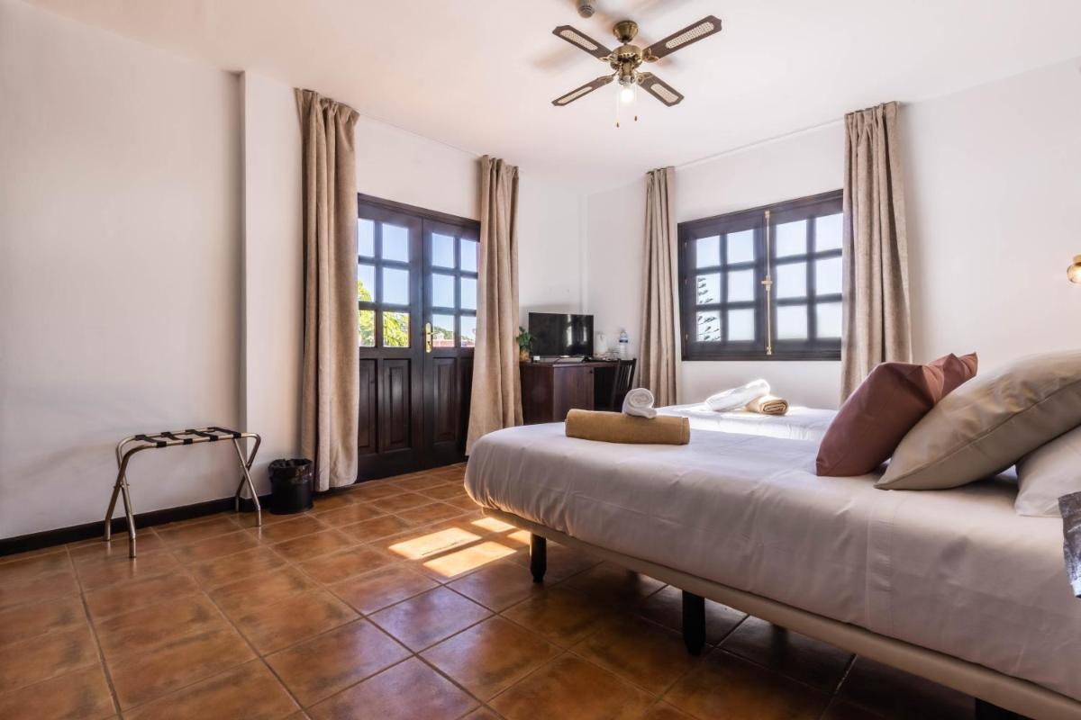 Cama o camas de una habitación en Hotel Ecolife Tenerife