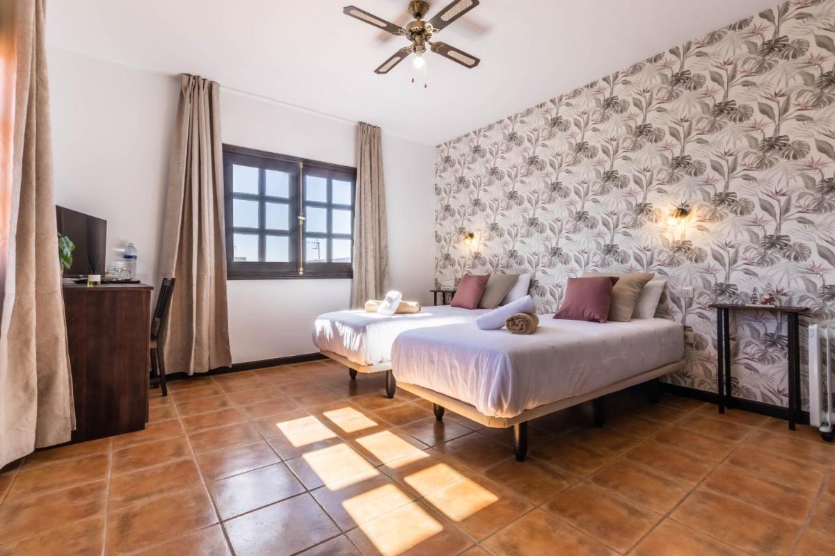 Cama o camas de una habitación en Hotel Ecolife Tenerife