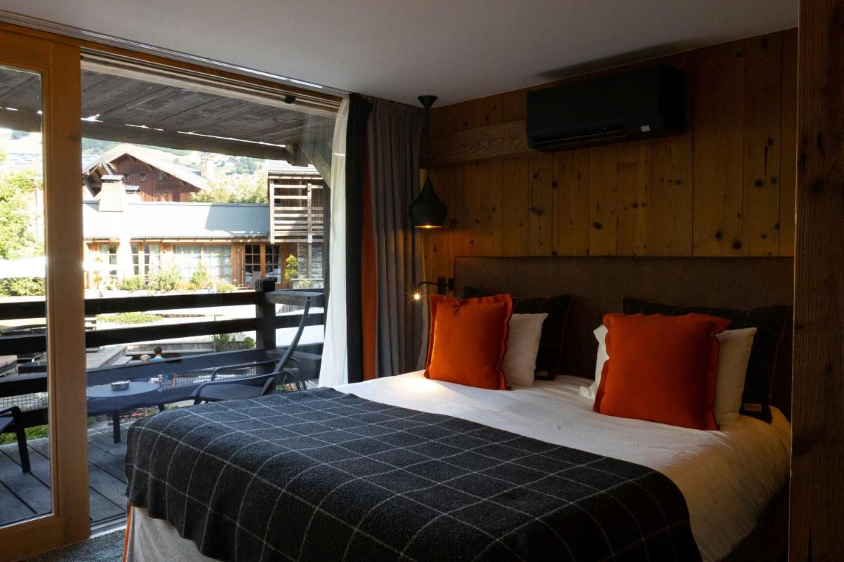 Un ou plusieurs lits dans un hébergement de l'établissement M de Megève