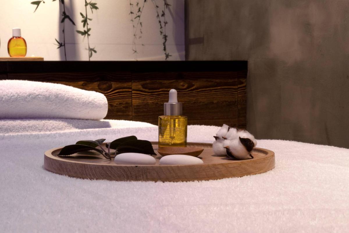 Un ou plusieurs lits dans un hébergement de l'établissement M de Megève