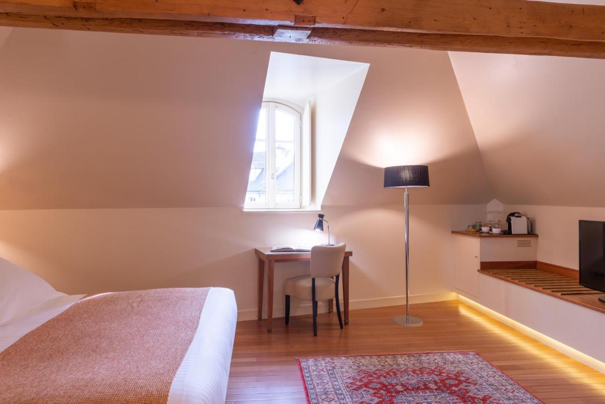 Un ou plusieurs lits dans un hébergement de l'établissement L'Hôtel