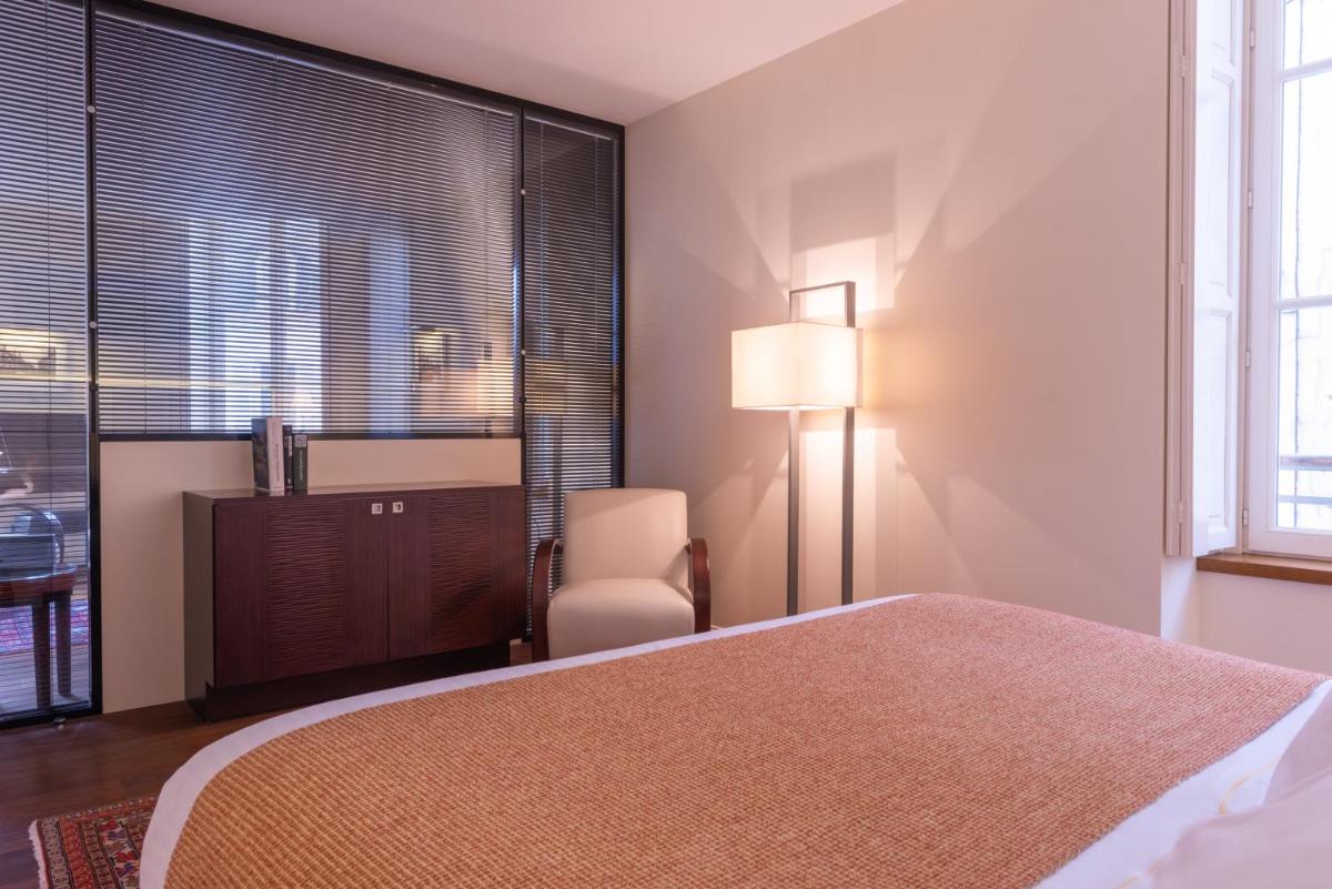 Un ou plusieurs lits dans un hébergement de l'établissement L'Hôtel