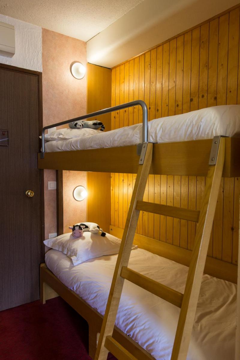 Un ou plusieurs lits dans un hébergement de l'établissement Hôtel-Résidence Le Lys