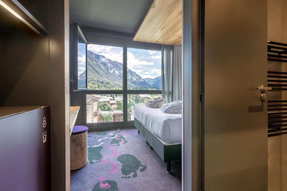 Un ou plusieurs lits dans un hébergement de l'établissement Alpina Eclectic Hotel