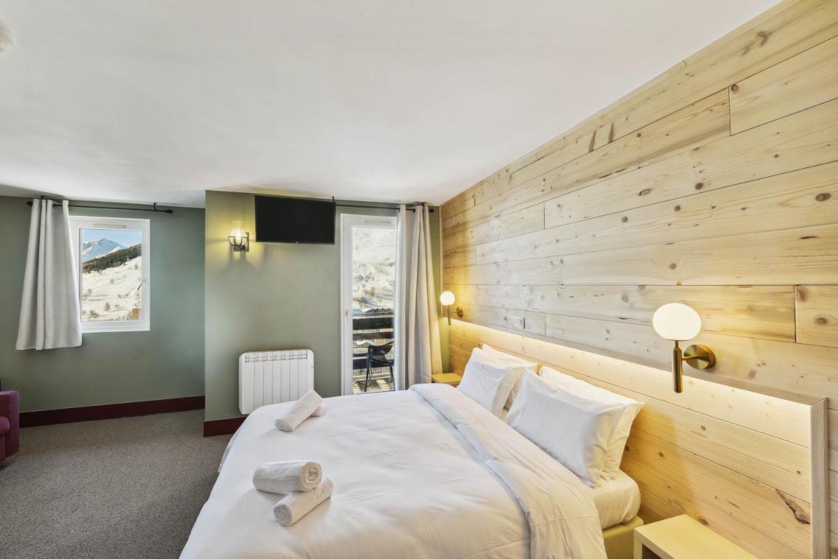 Un ou plusieurs lits dans un hébergement de l'établissement Hotel Turan & Spa