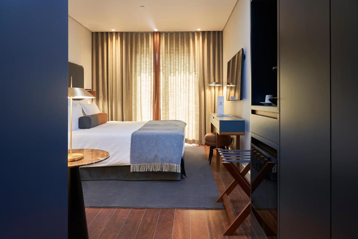 Uma cama ou camas num quarto em PortoBay Flores