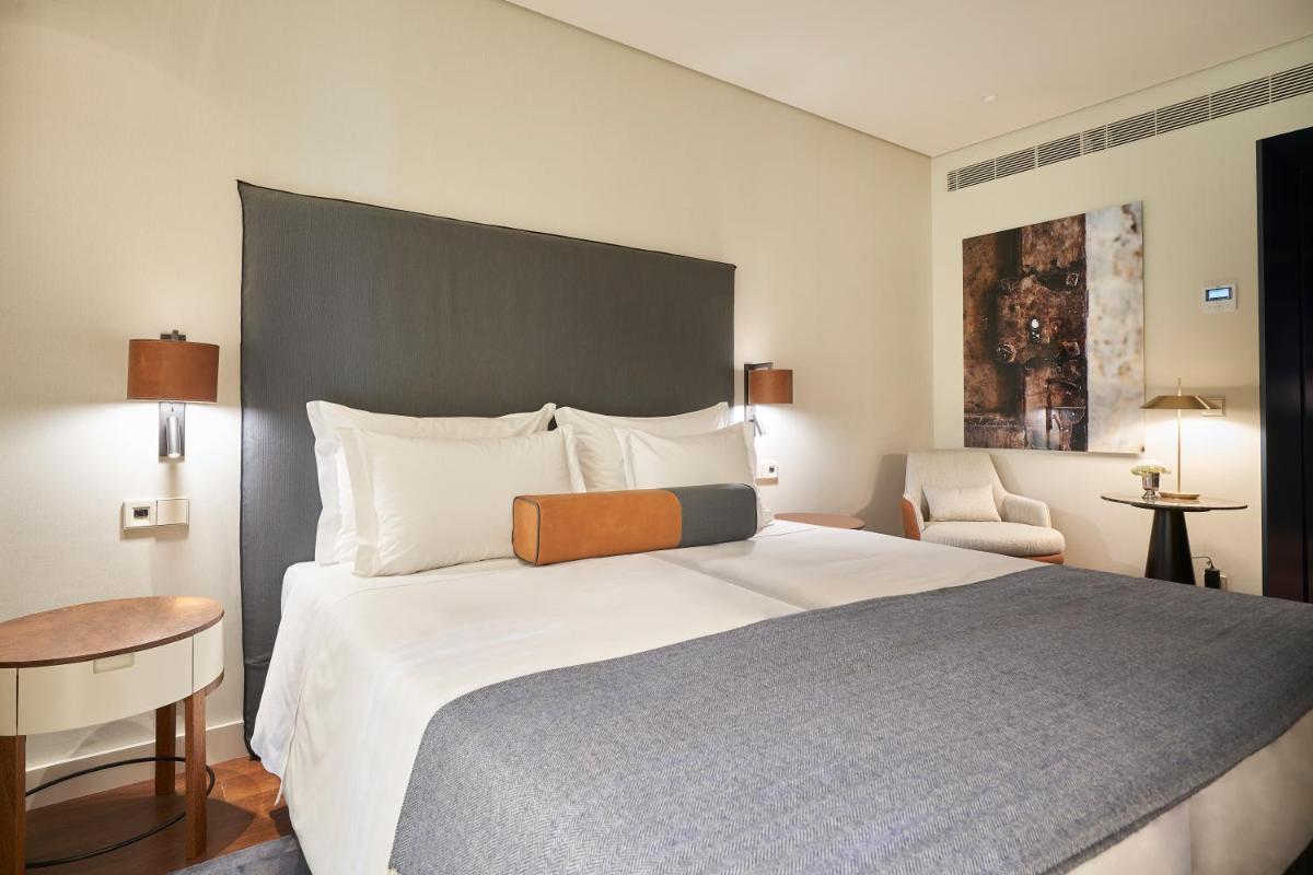 Uma cama ou camas num quarto em PortoBay Flores