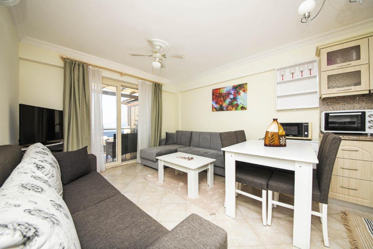 Sleek Flat with Private Beach and View in Milas - Housity