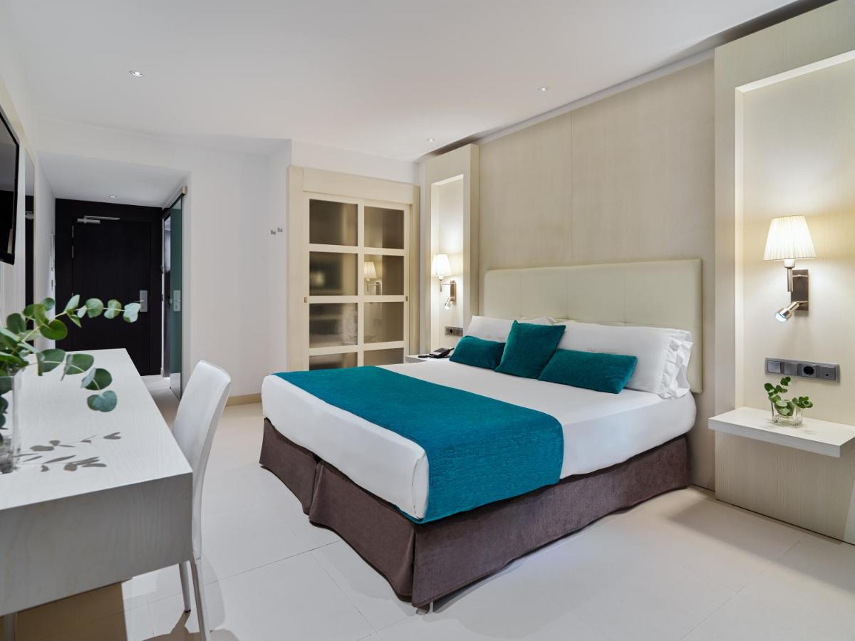 Cama o camas de una habitación en Hotel Saratoga