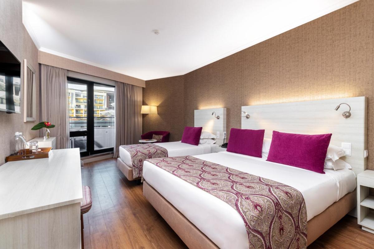 Uma cama ou camas num quarto em Enotel Lido - All Inclusive