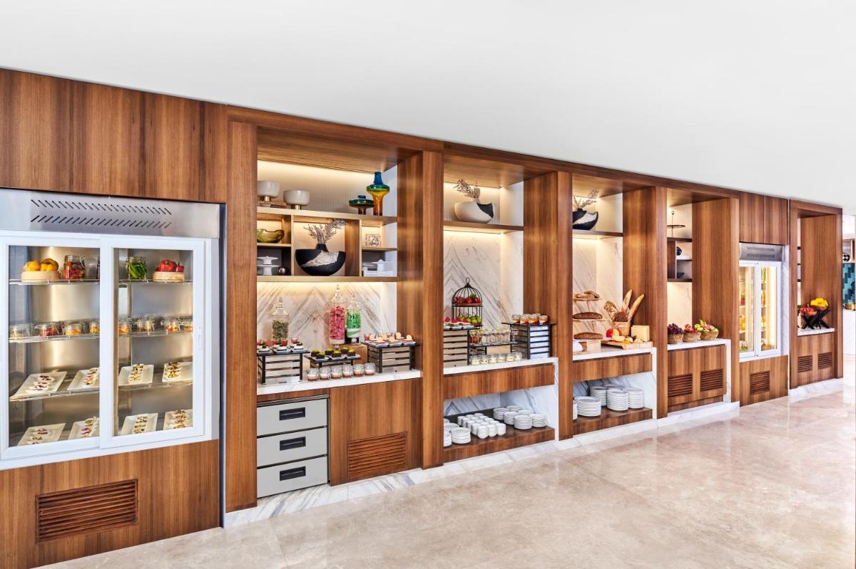 a store display case with shoes on display at Novotel Mumbai International Airport in Mumbai
