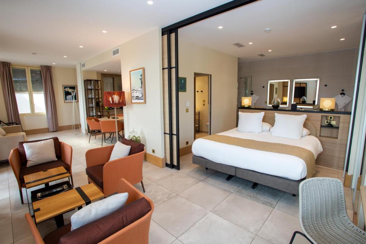 Un ou plusieurs lits dans un hébergement de l'établissement Splendid Hôtel & Spa