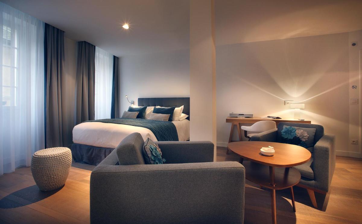 Un ou plusieurs lits dans un hébergement de l'établissement Petit Hôtel Confidentiel