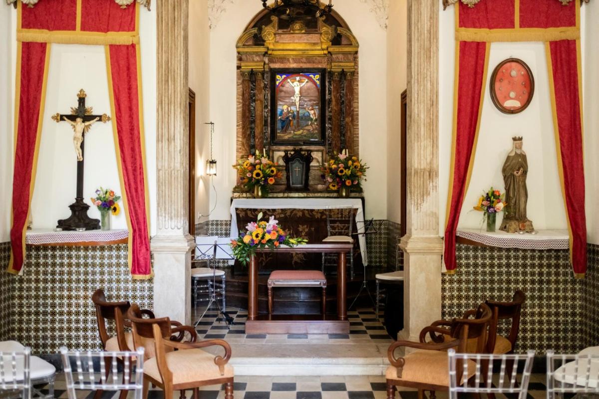 Uma área de estar em Hotel Quinta das Lagrimas - Small Luxury Hotels