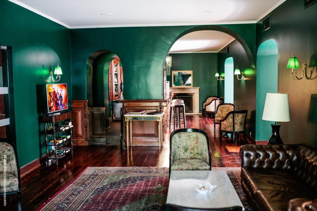 Uma área de estar em Hotel Quinta das Lagrimas - Small Luxury Hotels