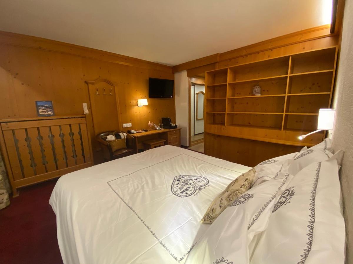 Un ou plusieurs lits dans un hébergement de l'établissement Hôtel Macchi Restaurant & Spa