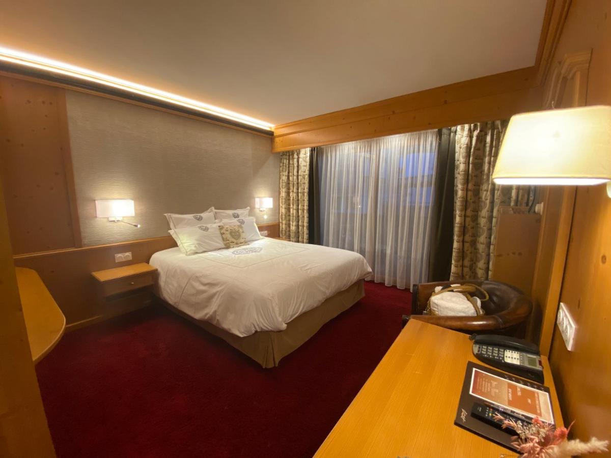 Un ou plusieurs lits dans un hébergement de l'établissement Hôtel Macchi Restaurant & Spa