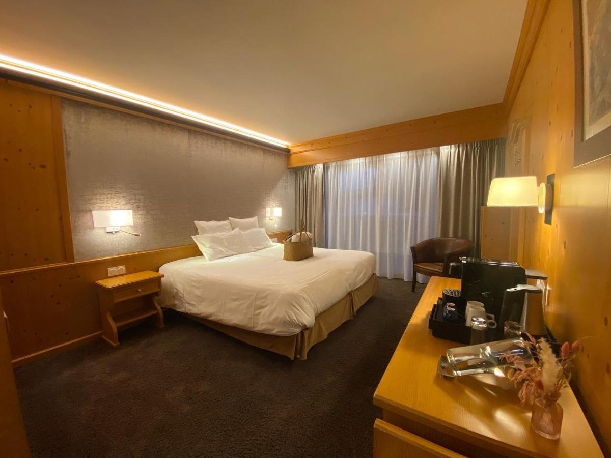 Un ou plusieurs lits dans un hébergement de l'établissement Hôtel Macchi Restaurant & Spa