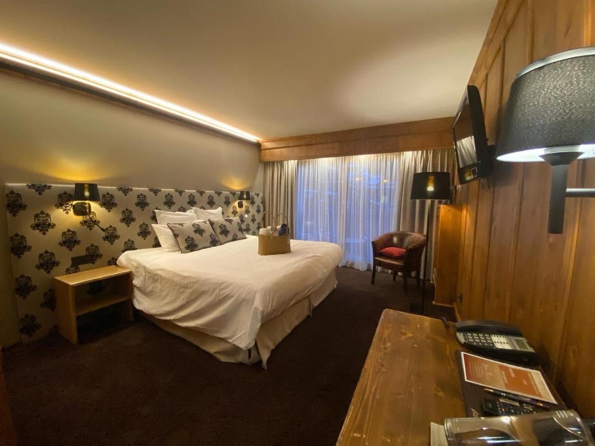 Un ou plusieurs lits dans un hébergement de l'établissement Hôtel Macchi Restaurant & Spa