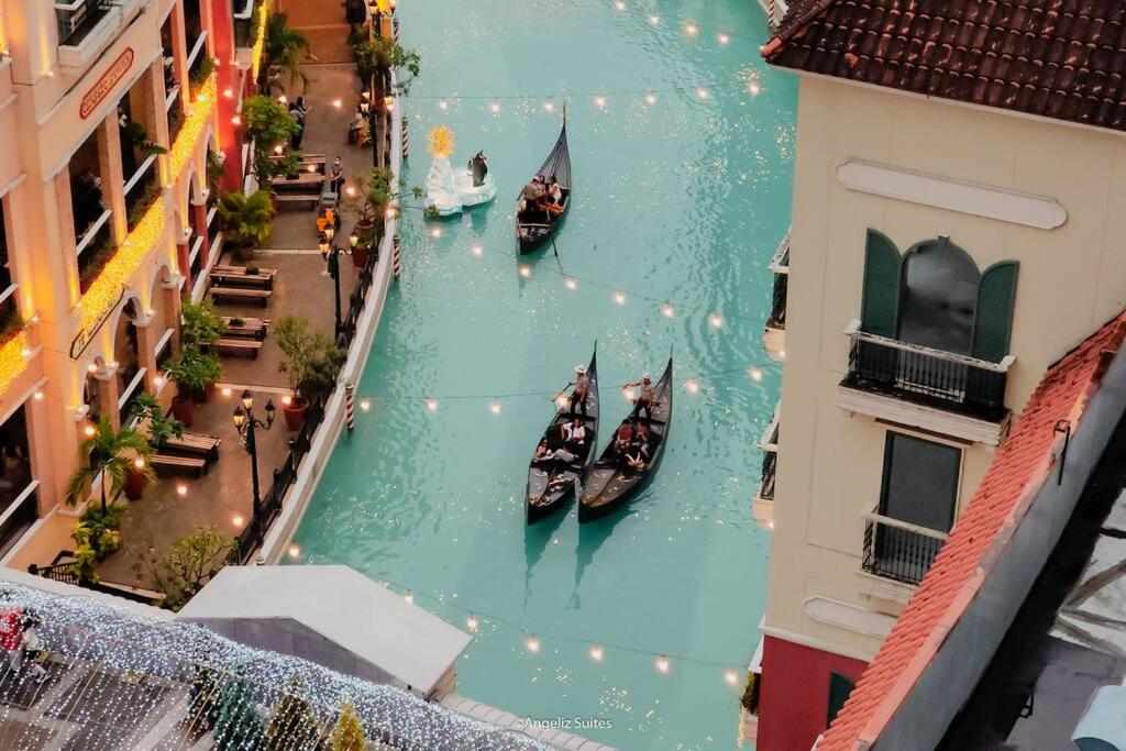 Suitetrails - NEW Modern Venice Best View and Balcony, Fast Wifi at McKinley Hill 1BR interconnected to Venice Grand Canal Mall