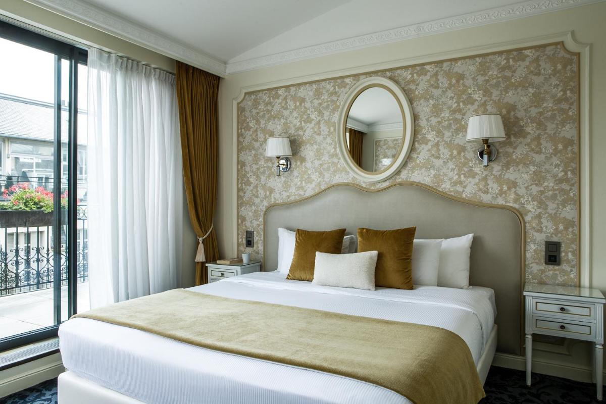 Un ou plusieurs lits dans un hébergement de l'établissement Hôtel Saint-Pétersbourg Opéra & Spa