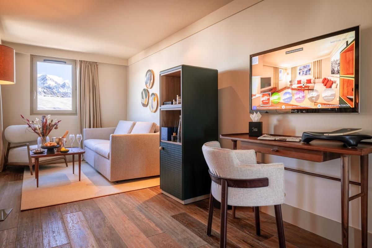 Coin salon dans l'établissement Les Suites de la Potinière