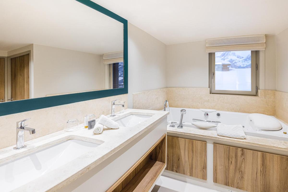 Salle de bains dans l'établissement Les Suites de la Potinière