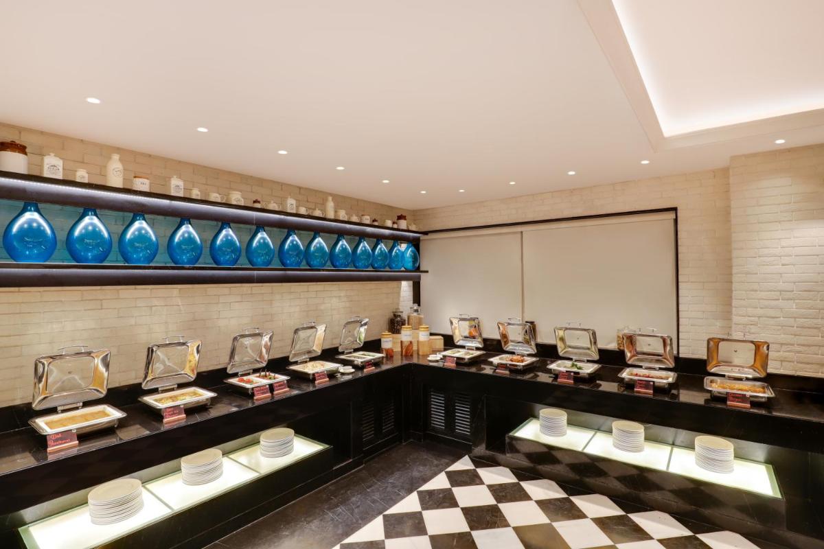 a dressing room with blue vases on display at Lemon Tree Premier, Mumbai International Airport in Mumbai