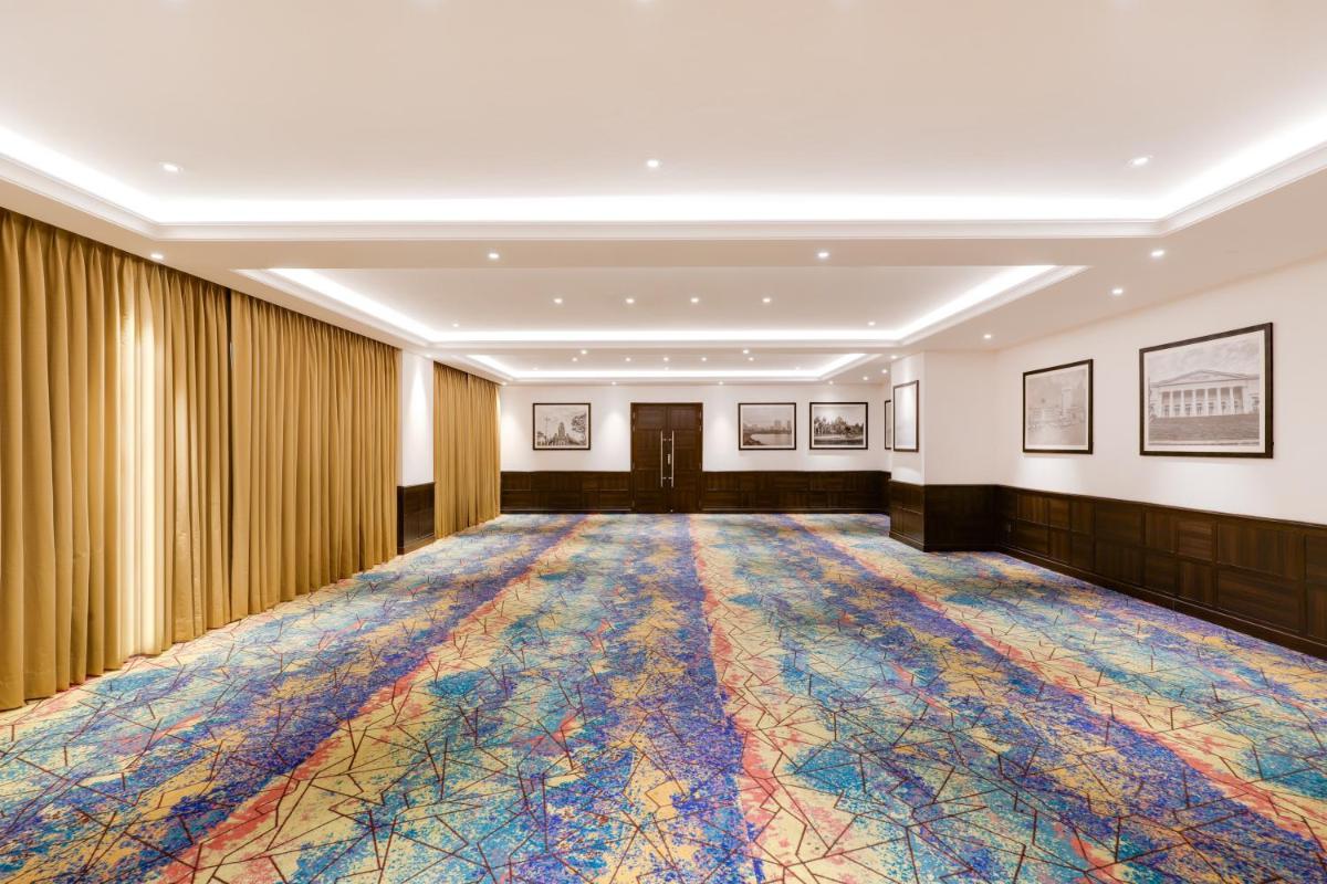 a large room with a large colorful carpet at Lemon Tree Premier, Mumbai International Airport in Mumbai
