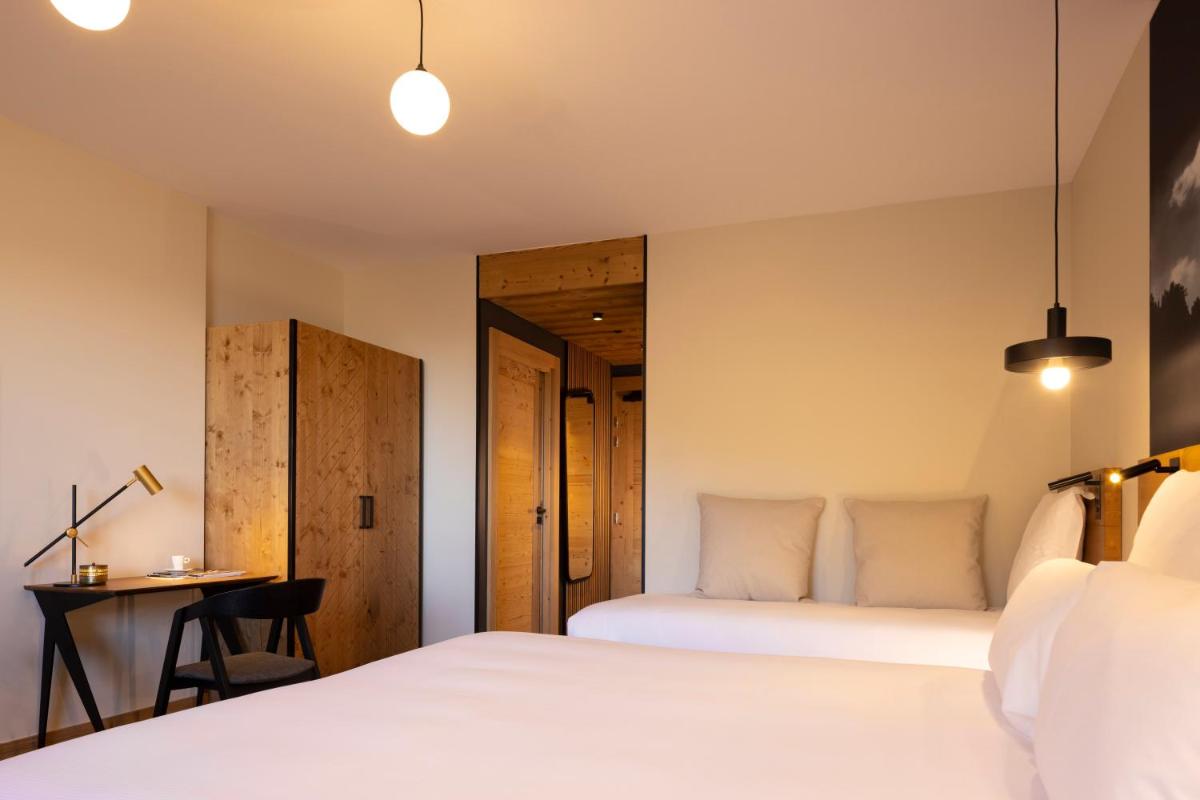 Un ou plusieurs lits dans un hébergement de l'établissement HIGALIK HOTEL