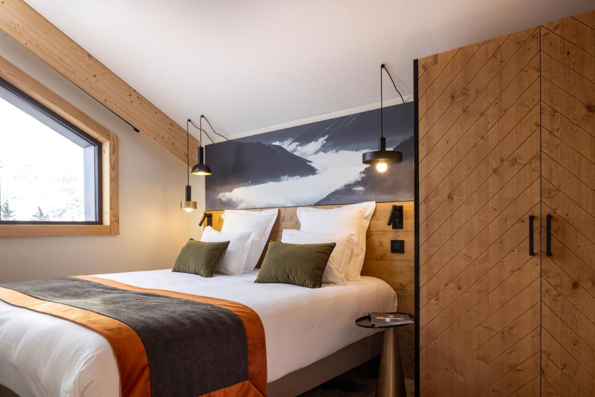 Un ou plusieurs lits dans un hébergement de l'établissement HIGALIK HOTEL
