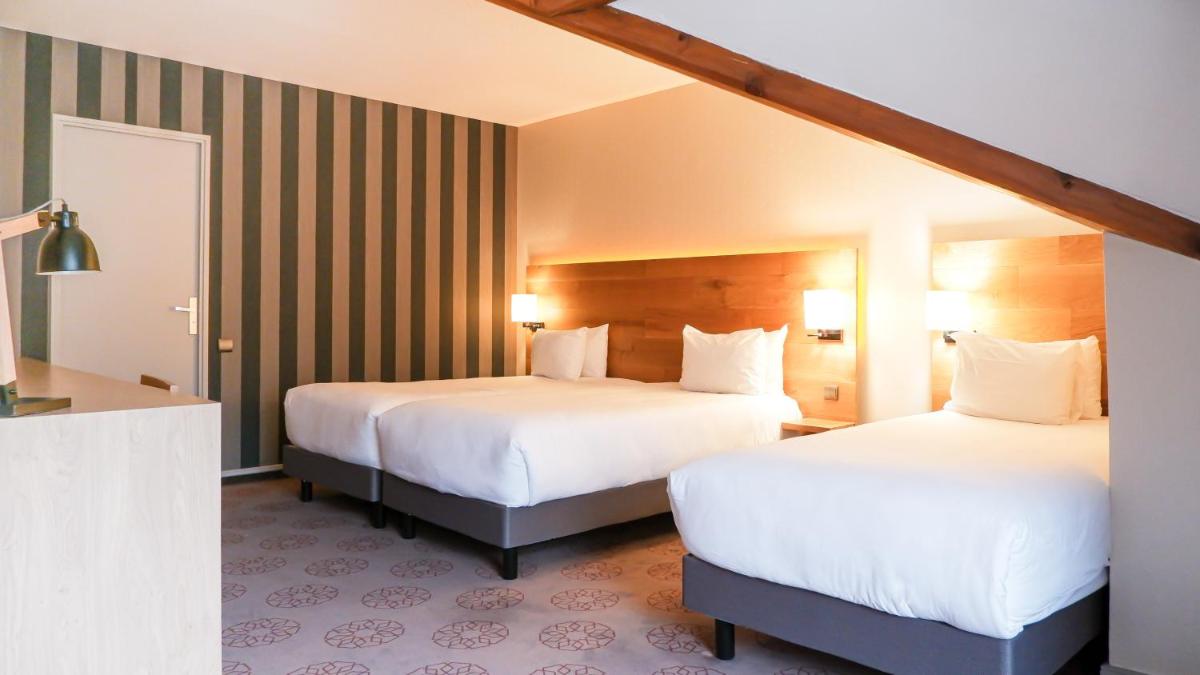 Un ou plusieurs lits dans un hébergement de l'établissement Mercure Saint-Lary