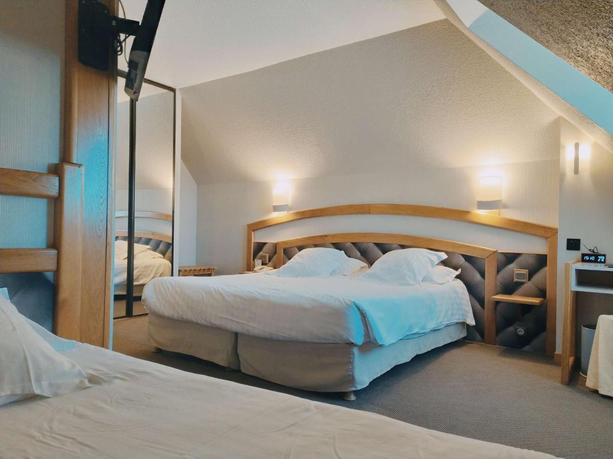 Un ou plusieurs lits dans un hébergement de l'établissement Best Western Le Relais de Laguiole Hôtel & Spa