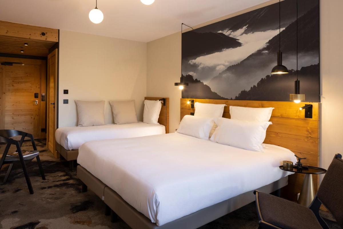 Un ou plusieurs lits dans un hébergement de l'établissement HIGALIK HOTEL