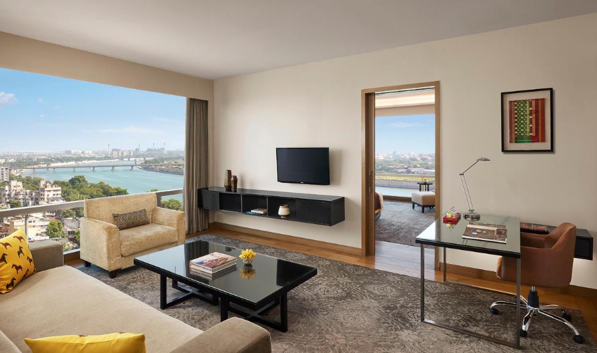 a living room with a view of a city at Hyatt Regency Ahmedabad in Ahmedabad