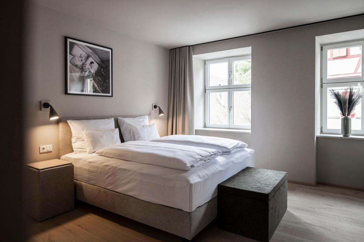 Ein Bett oder Betten in einem Zimmer der Unterkunft HOTEL & SPA Goldene Rose