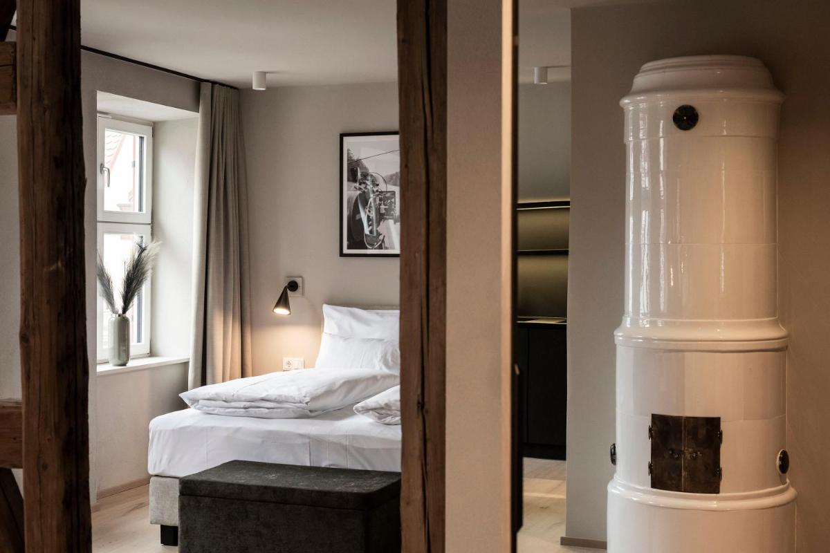 Ein Bett oder Betten in einem Zimmer der Unterkunft HOTEL & SPA Goldene Rose