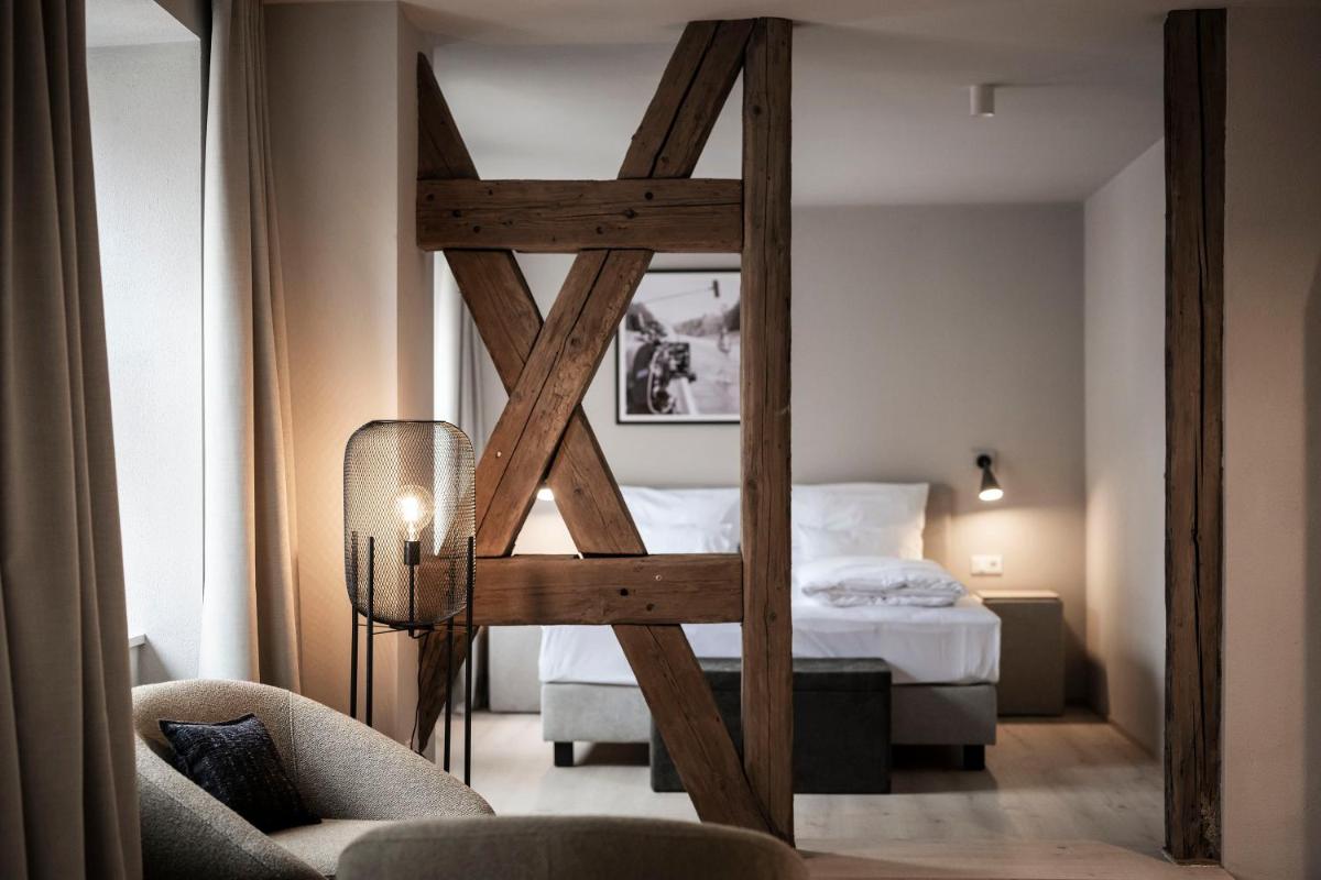 Ein Bett oder Betten in einem Zimmer der Unterkunft HOTEL & SPA Goldene Rose