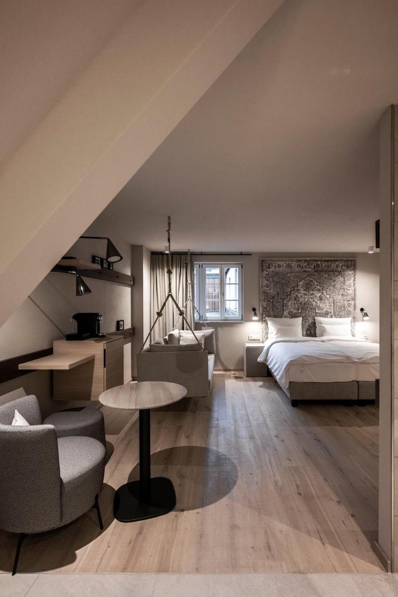 Ein Bett oder Betten in einem Zimmer der Unterkunft HOTEL & SPA Goldene Rose