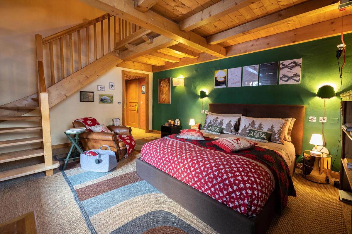 Un ou plusieurs lits dans un hébergement de l'établissement Magic Megève Bois