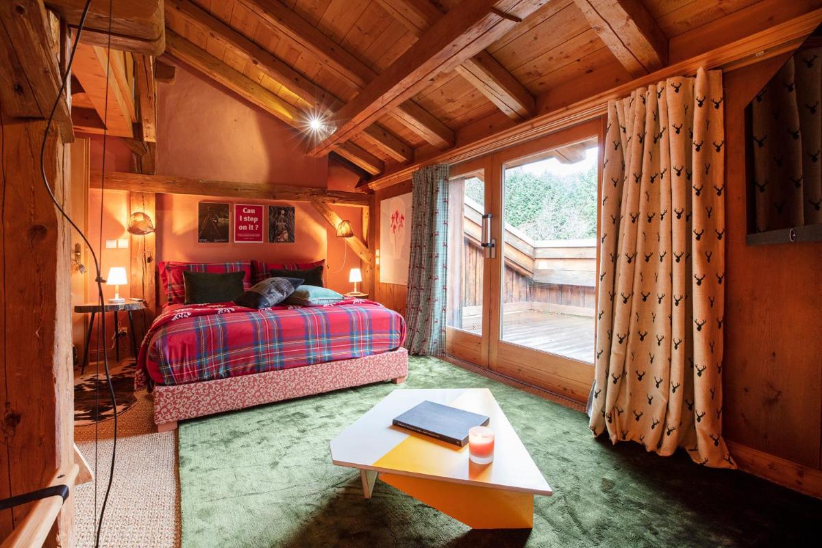 Un ou plusieurs lits dans un hébergement de l'établissement Magic Megève Bois