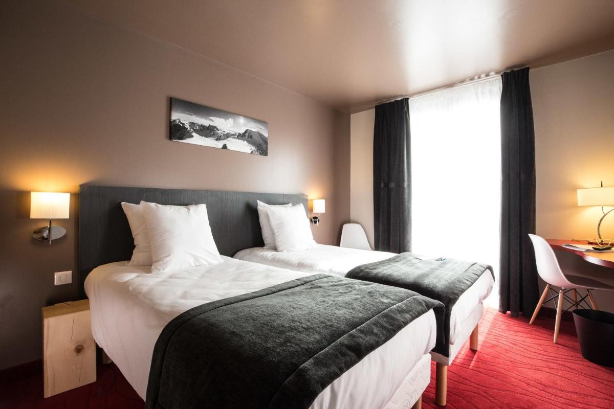 Un ou plusieurs lits dans un hébergement de l'établissement SOWELL HOTELS Le Parc & Spa