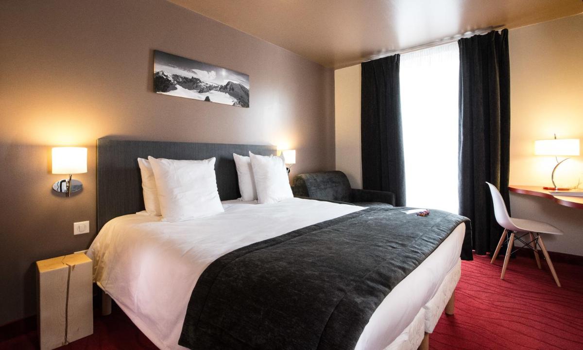 Un ou plusieurs lits dans un hébergement de l'établissement SOWELL HOTELS Le Parc & Spa